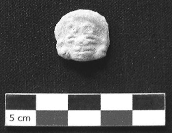 Figure 13. Thin Orange appliqué, possibly from a cylindrical vessel 
			(Photograph by author).
